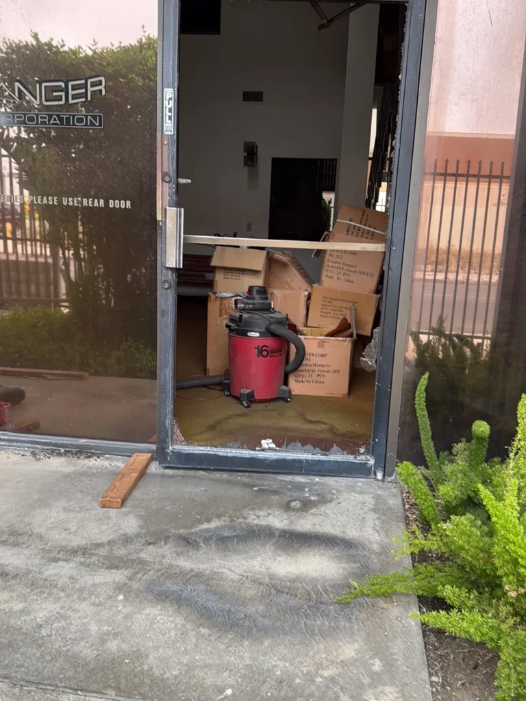 Unsafe residential glass door that cannot close safely, awaiting mobile emergency technicians.
