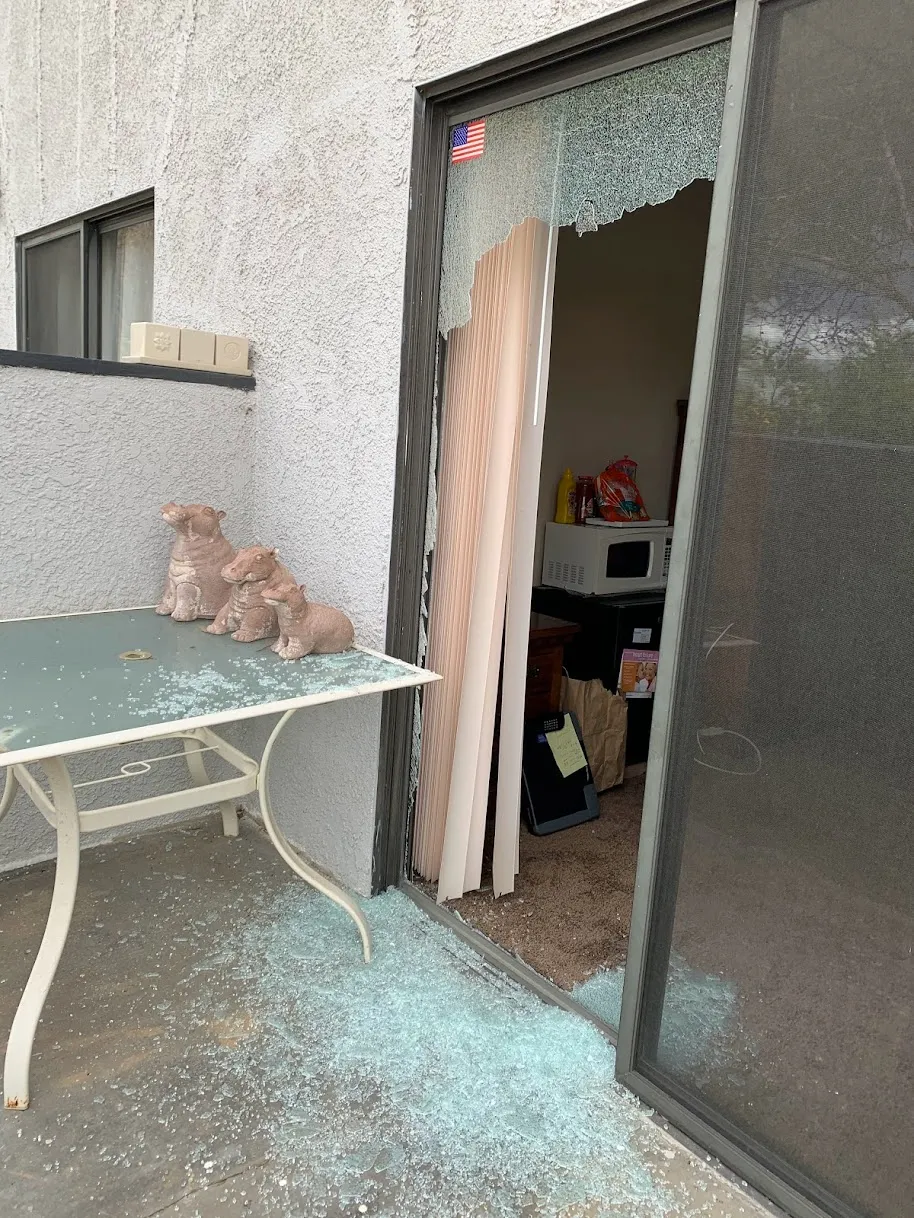 Broken glass panel in a residential sliding patio door